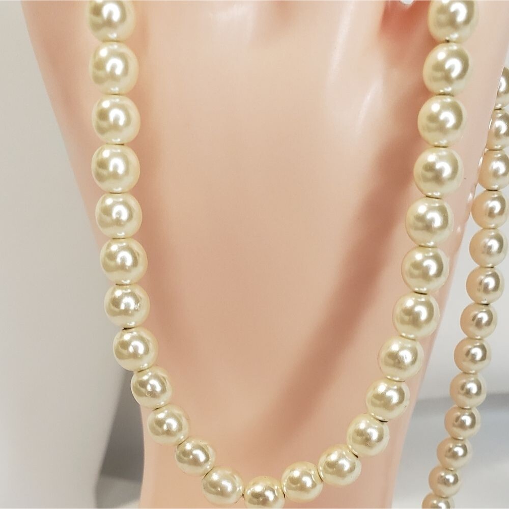 Single strand off white pearl necklace